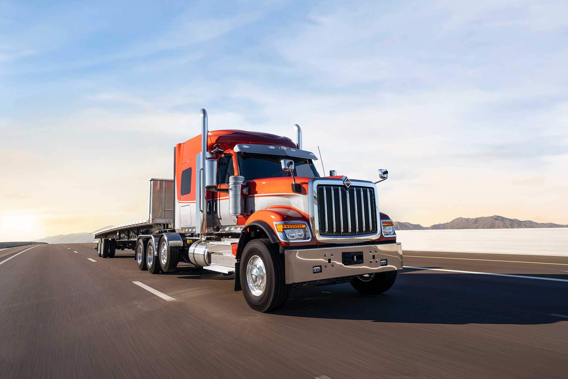 International HX Sleeper Semi Truck driving down the highway is a great example of the types of heavy duty trucks you can purchase at our dealership.